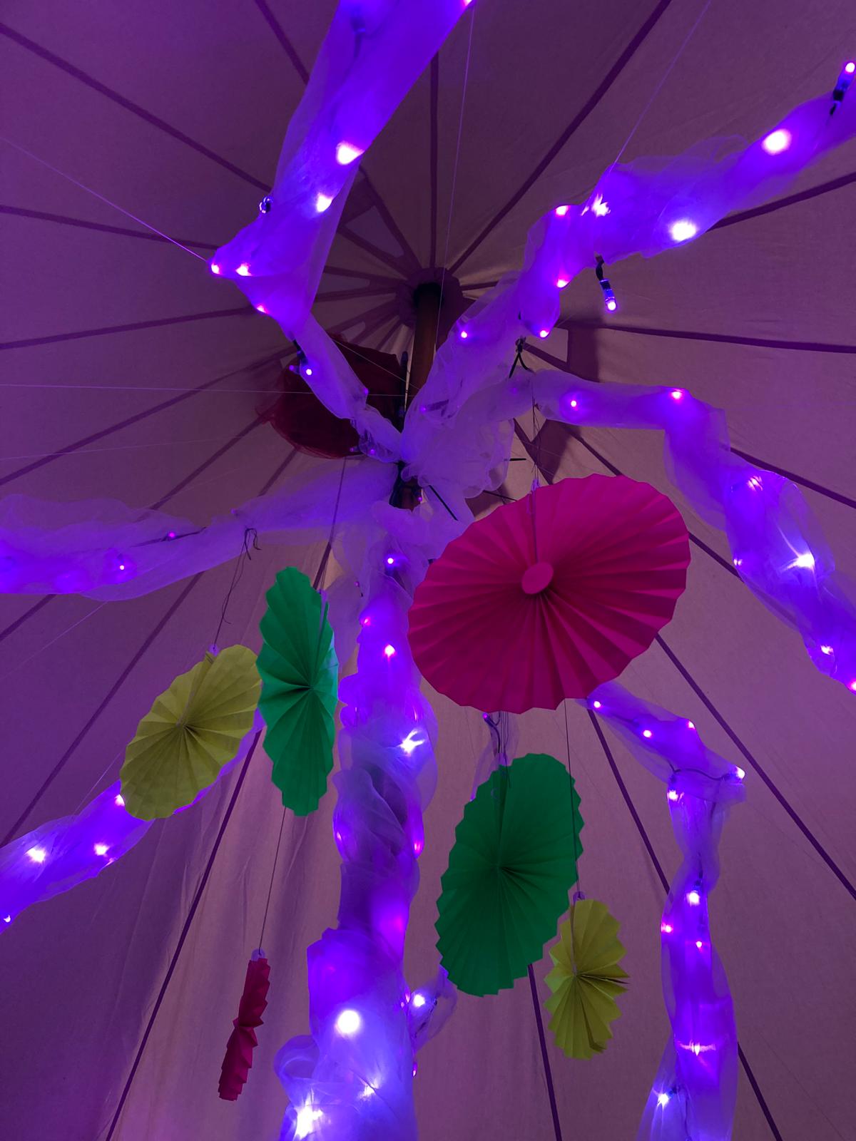 Inside the bell tent - spiral LEDs wrapped in organza.